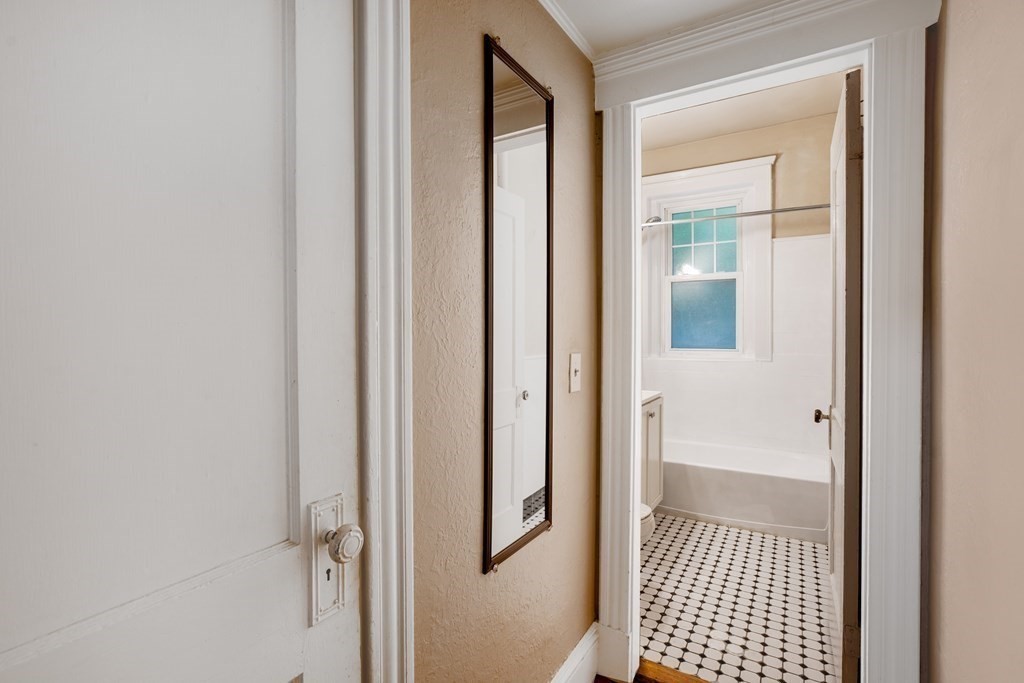 59 Lanark Road, Unit 2 Boston, MA 02135 - Photo 12 of 18 a view of a hallway with a glass door