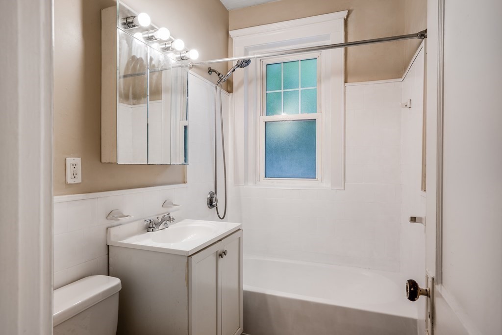 59 Lanark Road, Unit 2 Boston, MA 02135 - Photo 13 of 18 a bathroom with a sink toilet and shower
