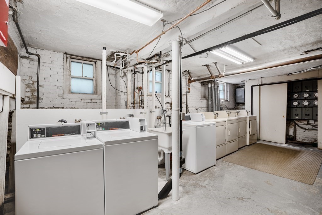 59 Lanark Road, Unit 2 Boston, MA 02135 - Photo 15 of 18 a bathroom with sink mirror vanity and shower
