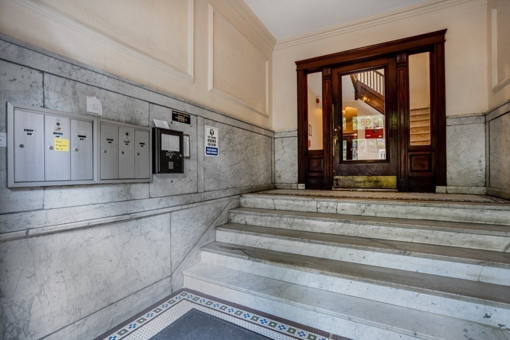 59 Lanark Road, Unit 2 Boston, MA 02135 - Photo 16 of 18 a view of entryway and hall with wooden floor