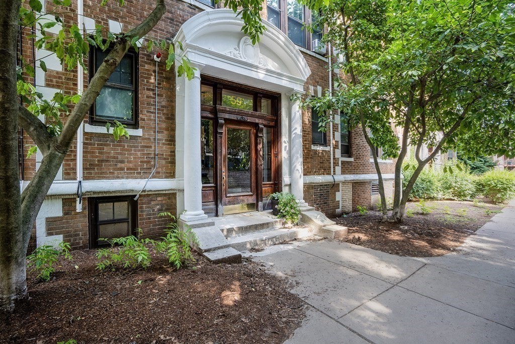 59 Lanark Road, Unit 2 Boston, MA 02135 - Photo 17 of 18 a brick building with a tree in front of it