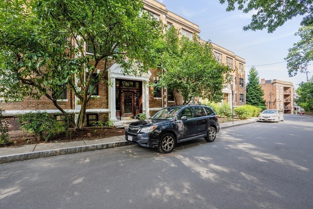 59 Lanark Road, Unit 2 Boston, MA 02135 - Photo 18 of 18 a car parked in front of a house