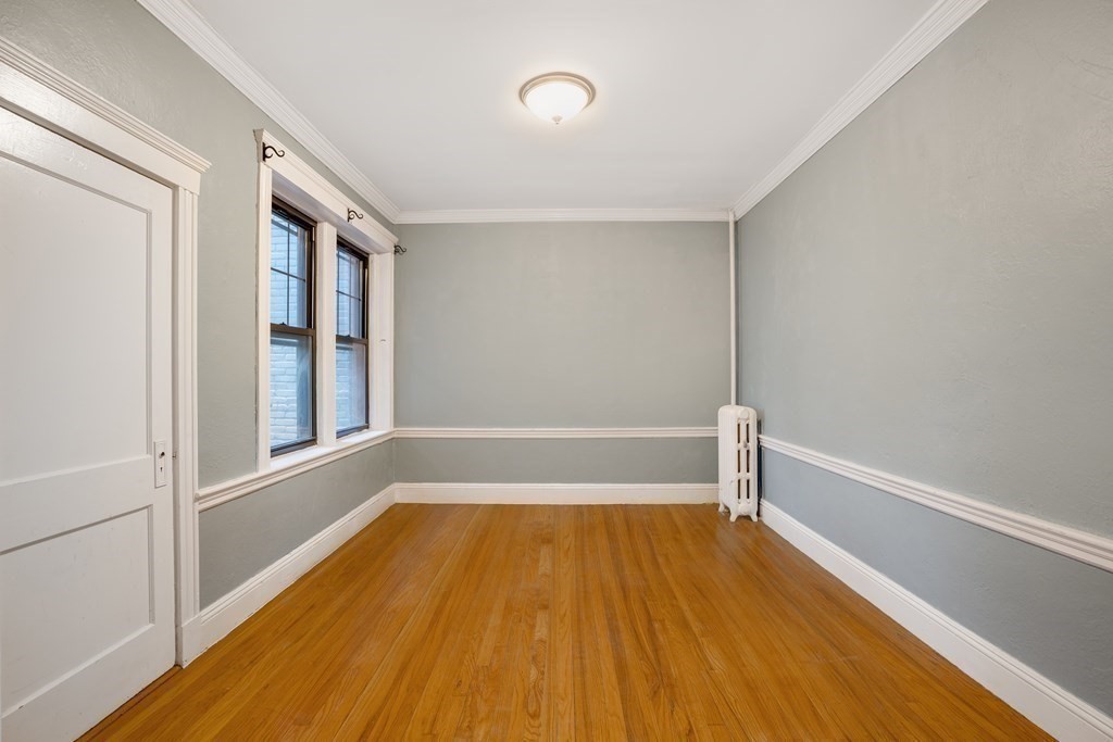 59 Lanark Road, Unit 2 Boston, MA 02135 - Photo 2 of 18 a view of a room with wooden floor and tub