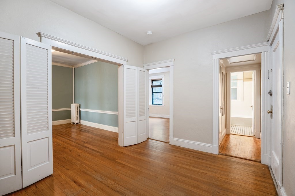 59 Lanark Road, Unit 2 Boston, MA 02135 - Photo 8 of 18 a view of empty room with wooden floor