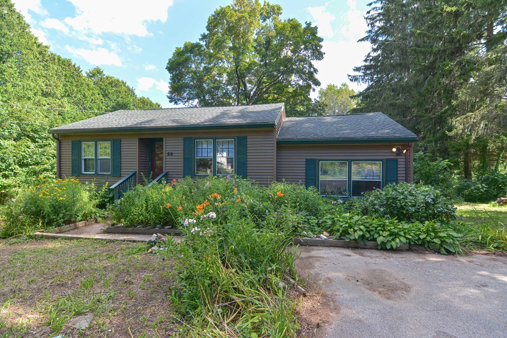 69 Stafford Road Holland, MA 01521 - Photo 1 of 27 a front view of a house with a yard