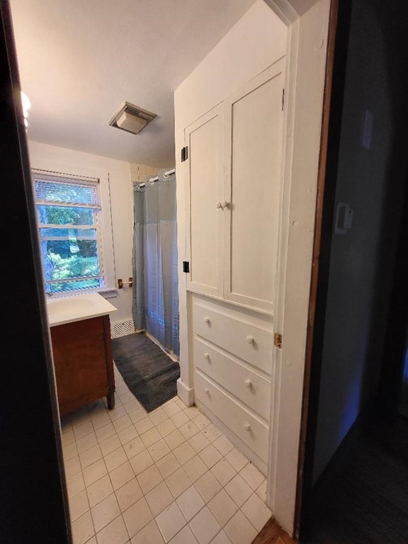 69 Stafford Road Holland, MA 01521 - Photo 17 of 27 a bedroom with a bed and a dresser