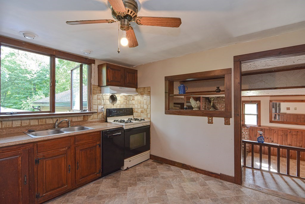 69 Stafford Road Holland, MA 01521 - Photo 2 of 27 a kitchen with stainless steel appliances granite countertop a sink stove and refrigerator