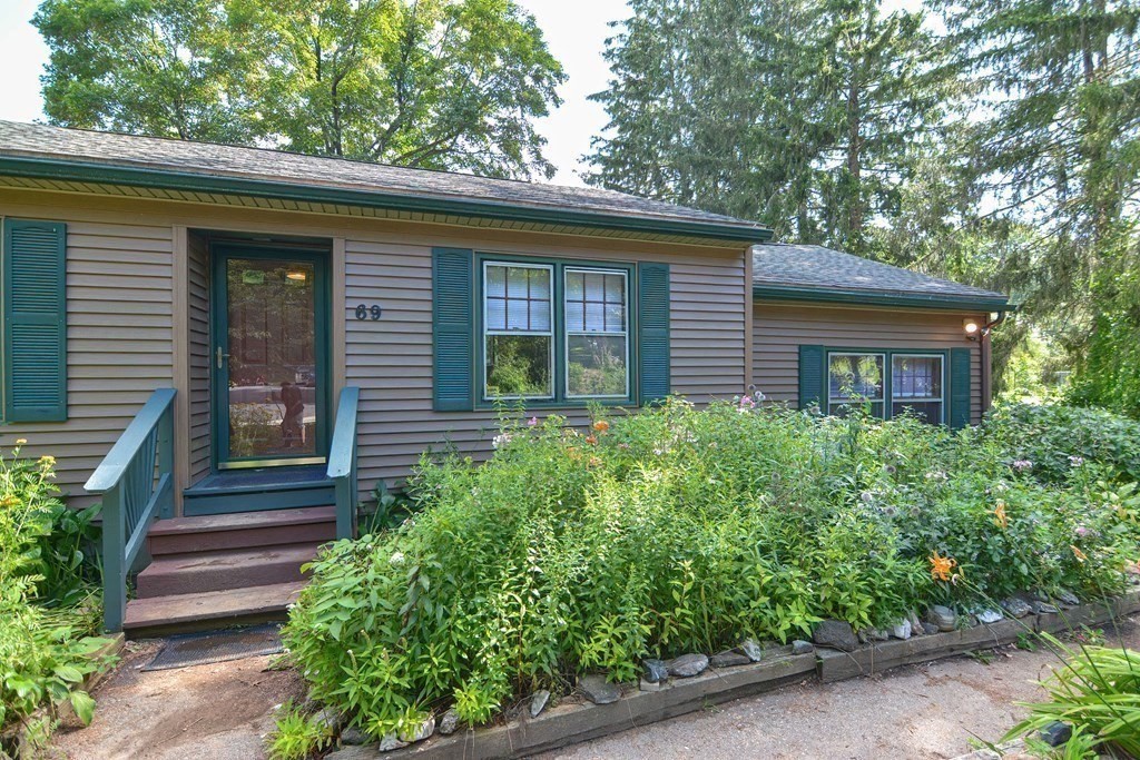 69 Stafford Road Holland, MA 01521 - Photo 22 of 27 a front view of a house with plants