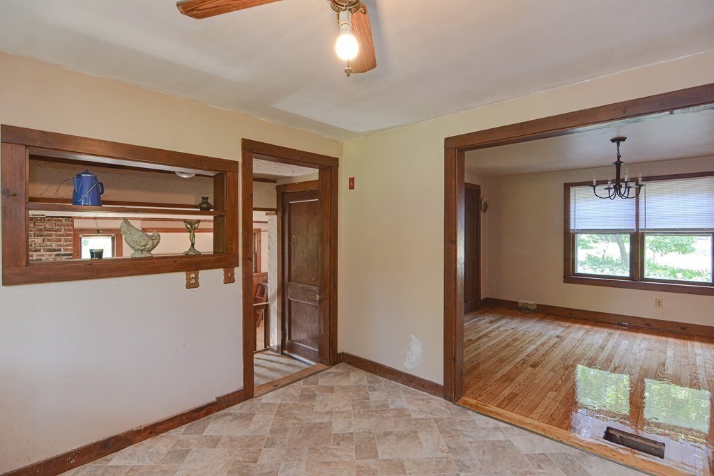 69 Stafford Road Holland, MA 01521 - Photo 6 of 27 a view of empty room with window and fireplace