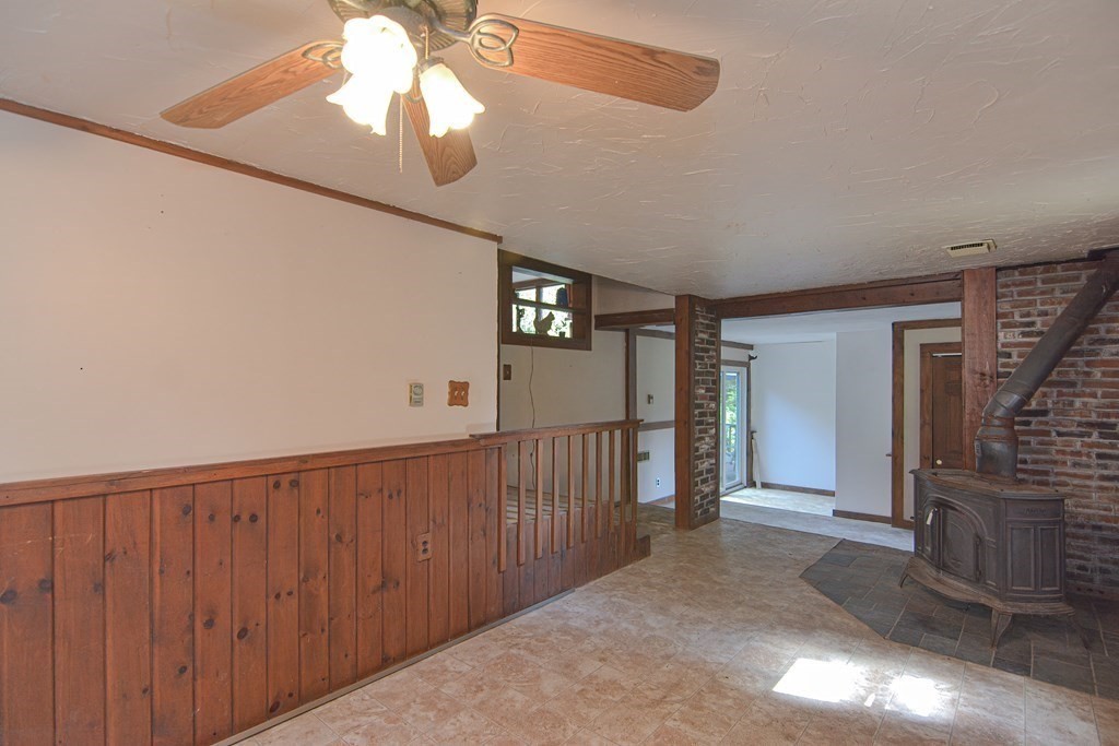 69 Stafford Road Holland, MA 01521 - Photo 8 of 27 a view of a hallway with wooden floor and entryway