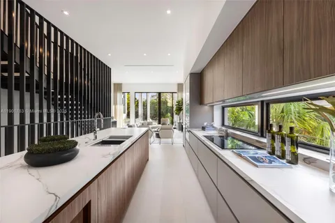 a kitchen with lots of counter top space and living space