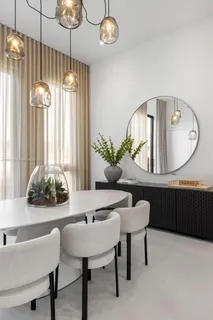 a view of a dining room with furniture and chandelier
