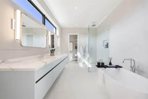 a bathroom with a double vanity sink mirror and double