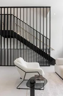 a balcony with table and chairs