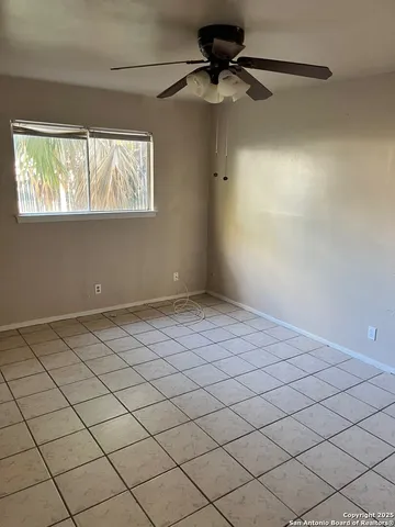 a view of an empty room and window
