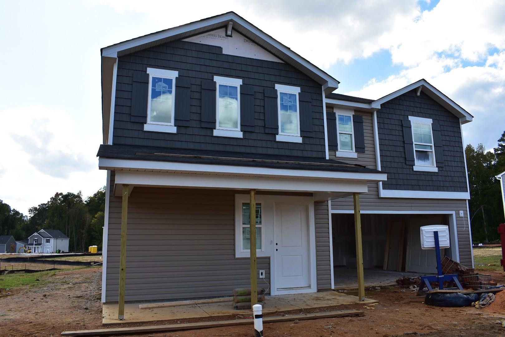 341 Riley Way Spring Hope, NC 27882 - Photo 3 of 13 a front view of a house with garden