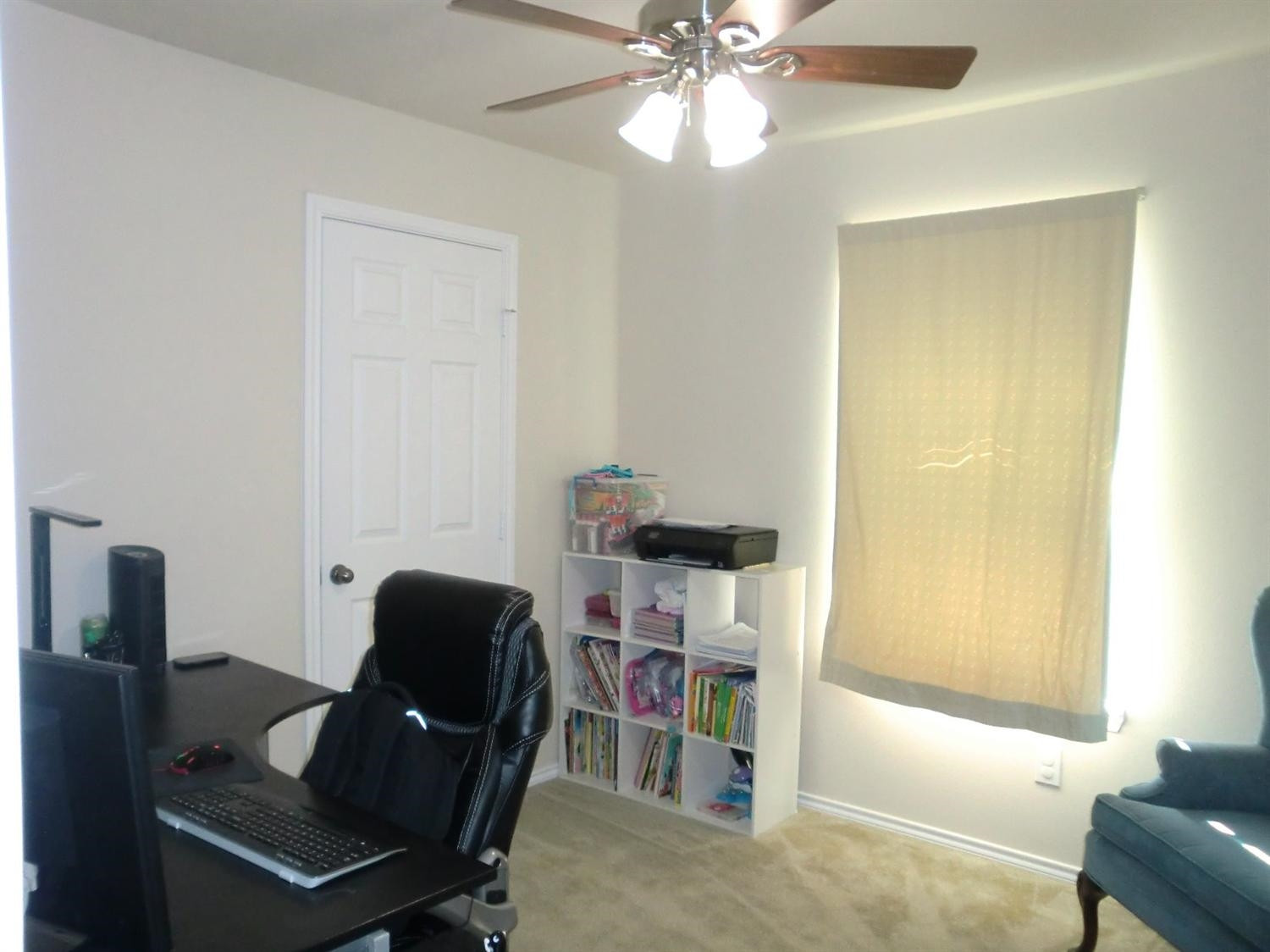 6706 84th Street Lubbock, TX 79424 - Photo 2 of 10 a view of a workspace with furniture and a window