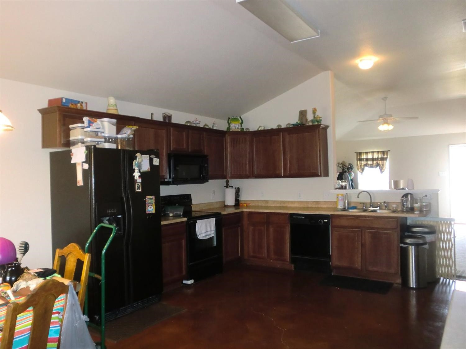 6706 84th Street Lubbock, TX 79424 - Photo 7 of 10 a kitchen with granite countertop a sink appliances and cabinets
