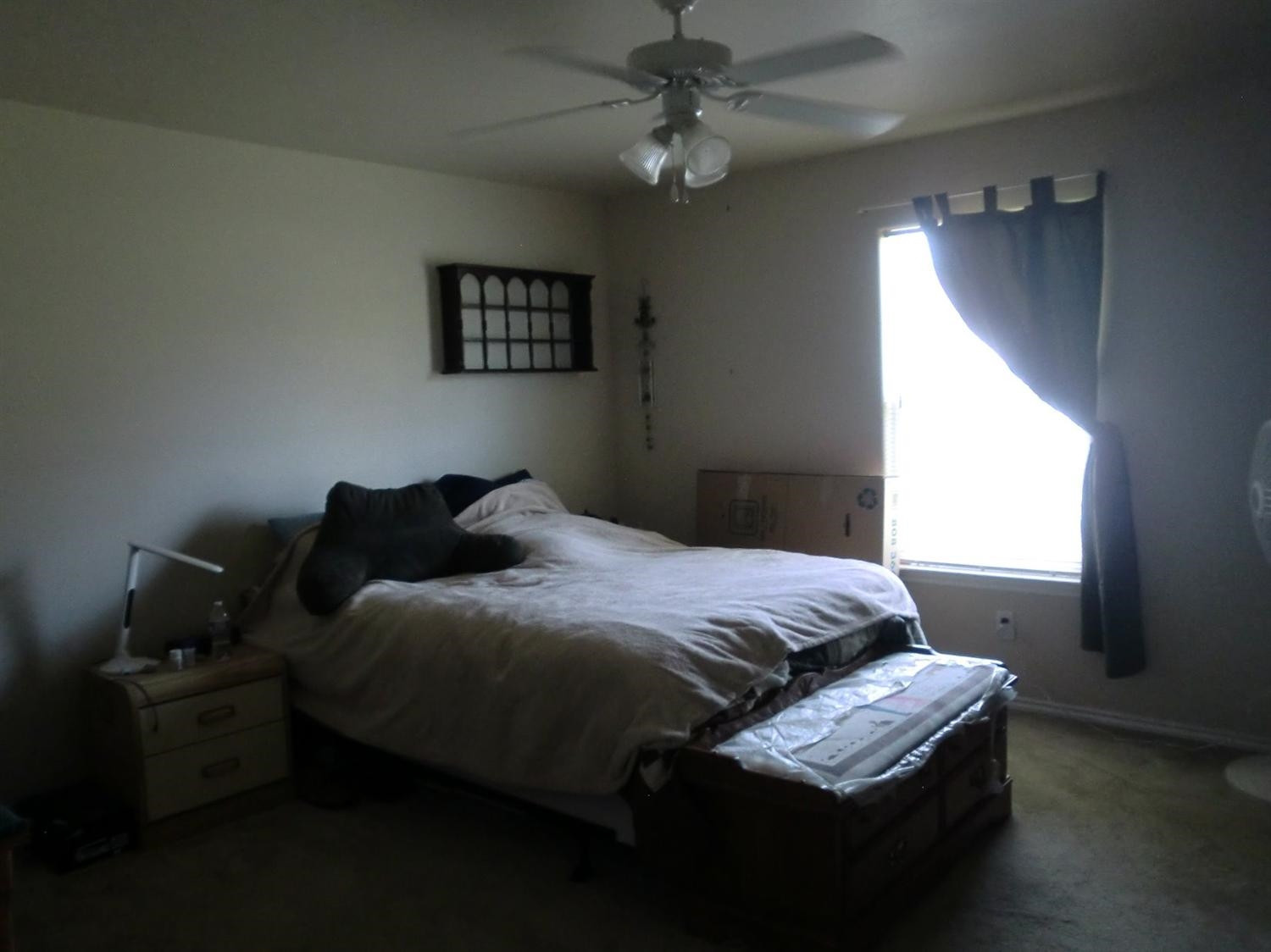 6706 84th Street Lubbock, TX 79424 - Photo 9 of 10 a bedroom with bed and window