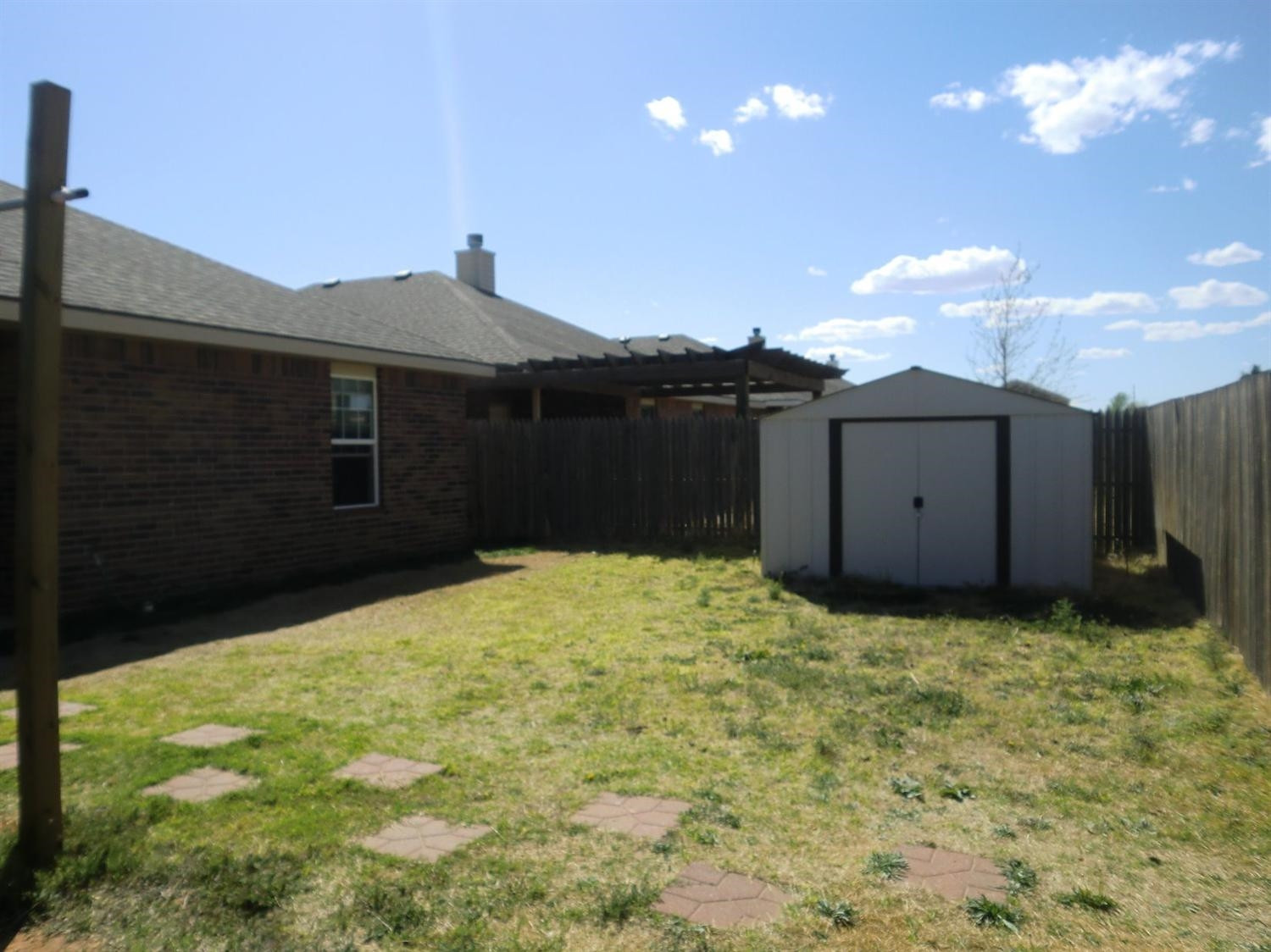 6706 84th Street Lubbock, TX 79424 - Photo 10 of 10 a backyard of a house