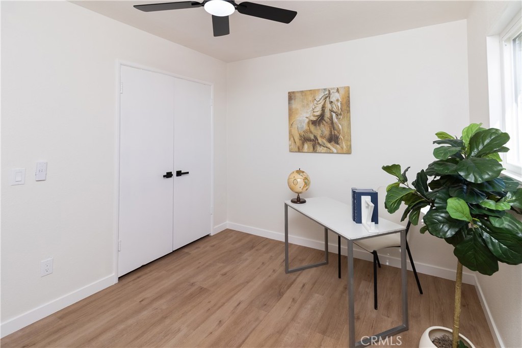 3306 Debbie Lane Riverside, CA 92501 - Photo 20 of 32 a view of a workspace with furniture and wooden floor