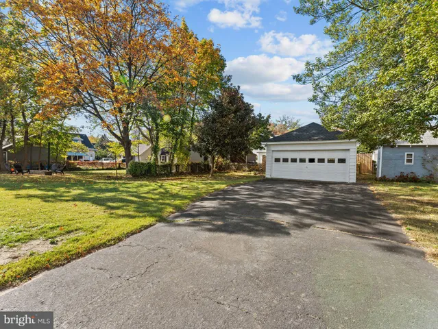 a view of a street with a building in the background