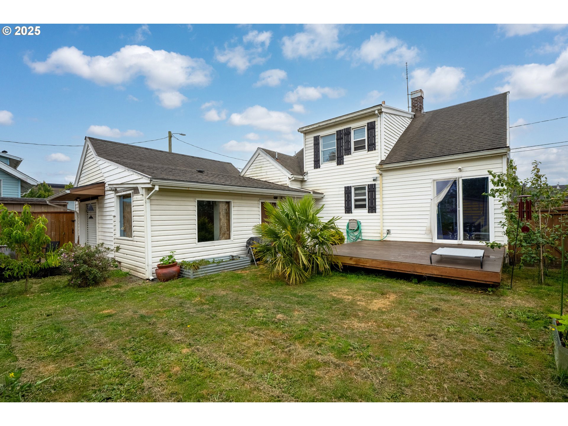 1706 5th Street Tillamook, OR 97141 - Photo 13 of 29 a view of a house with a yard and sitting area
