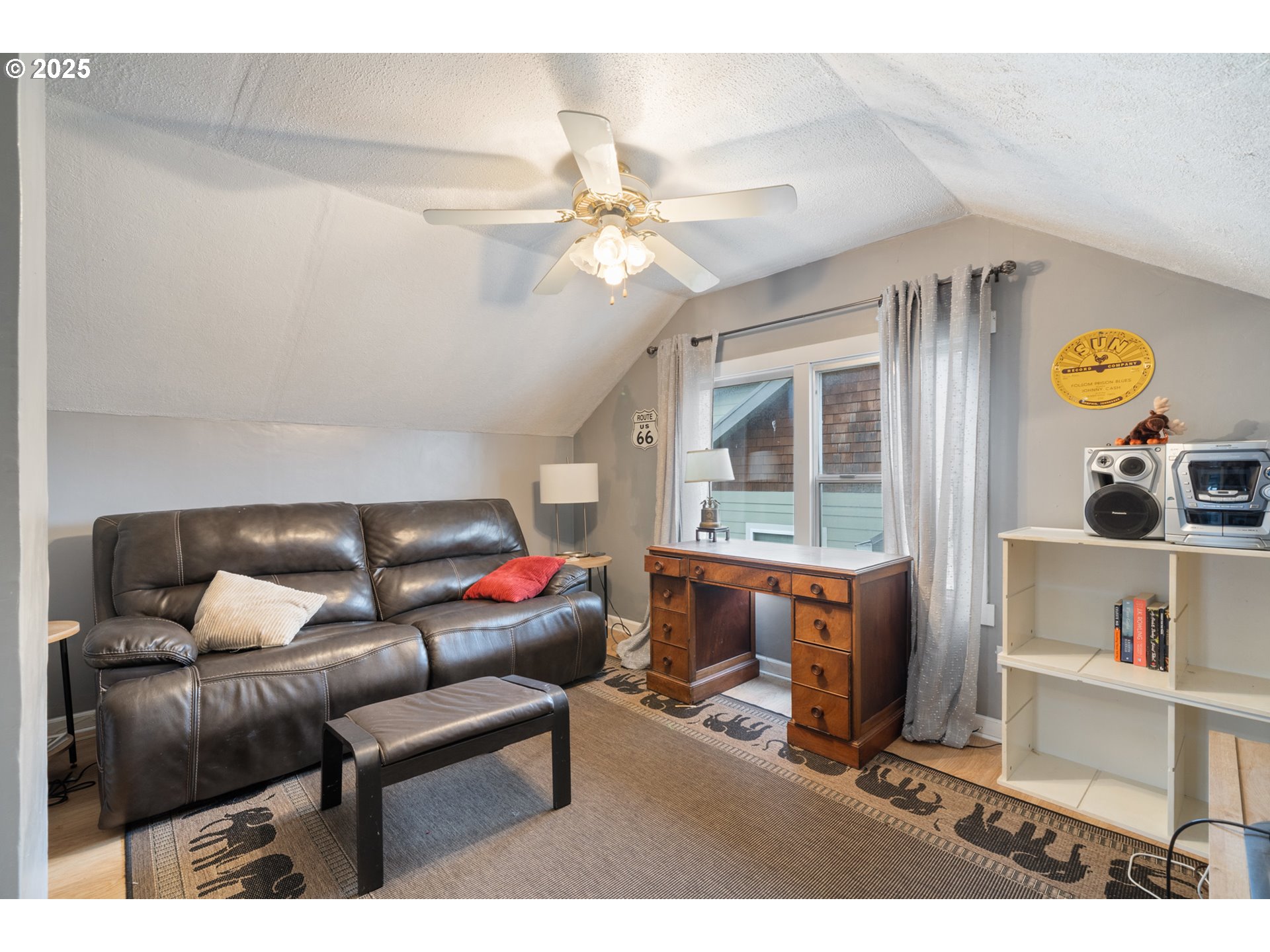 1706 5th Street Tillamook, OR 97141 - Photo 18 of 29 a living room with furniture and a window