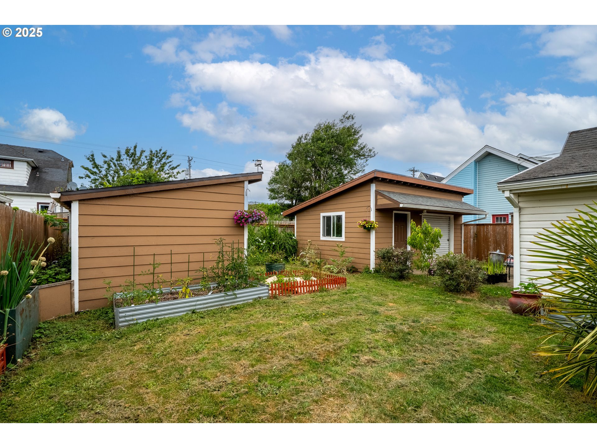 1706 5th Street Tillamook, OR 97141 - Photo 24 of 29 a view of house with backyard and garden
