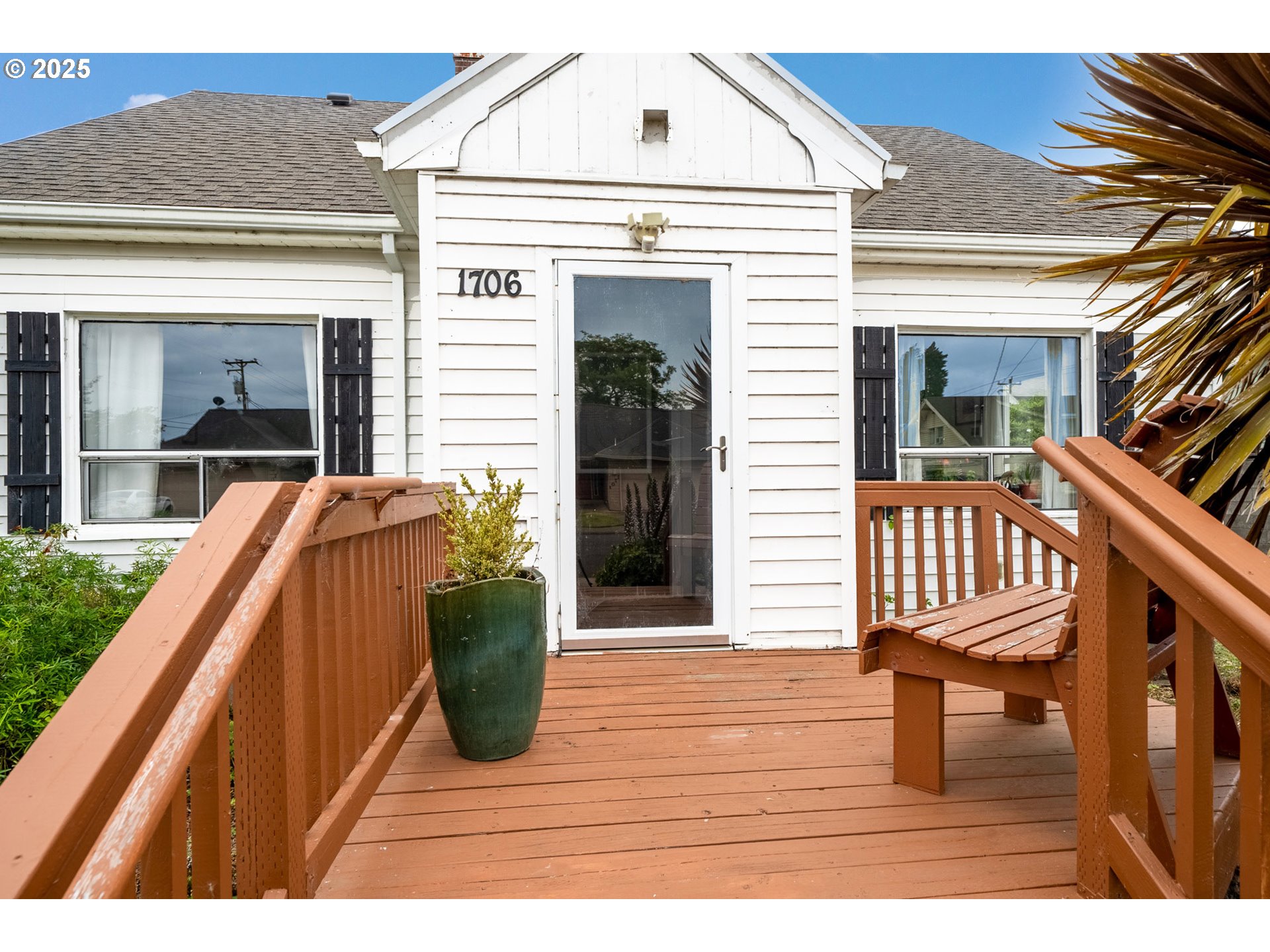 1706 5th Street Tillamook, OR 97141 - Photo 3 of 29 a view of a house with backyard and deck