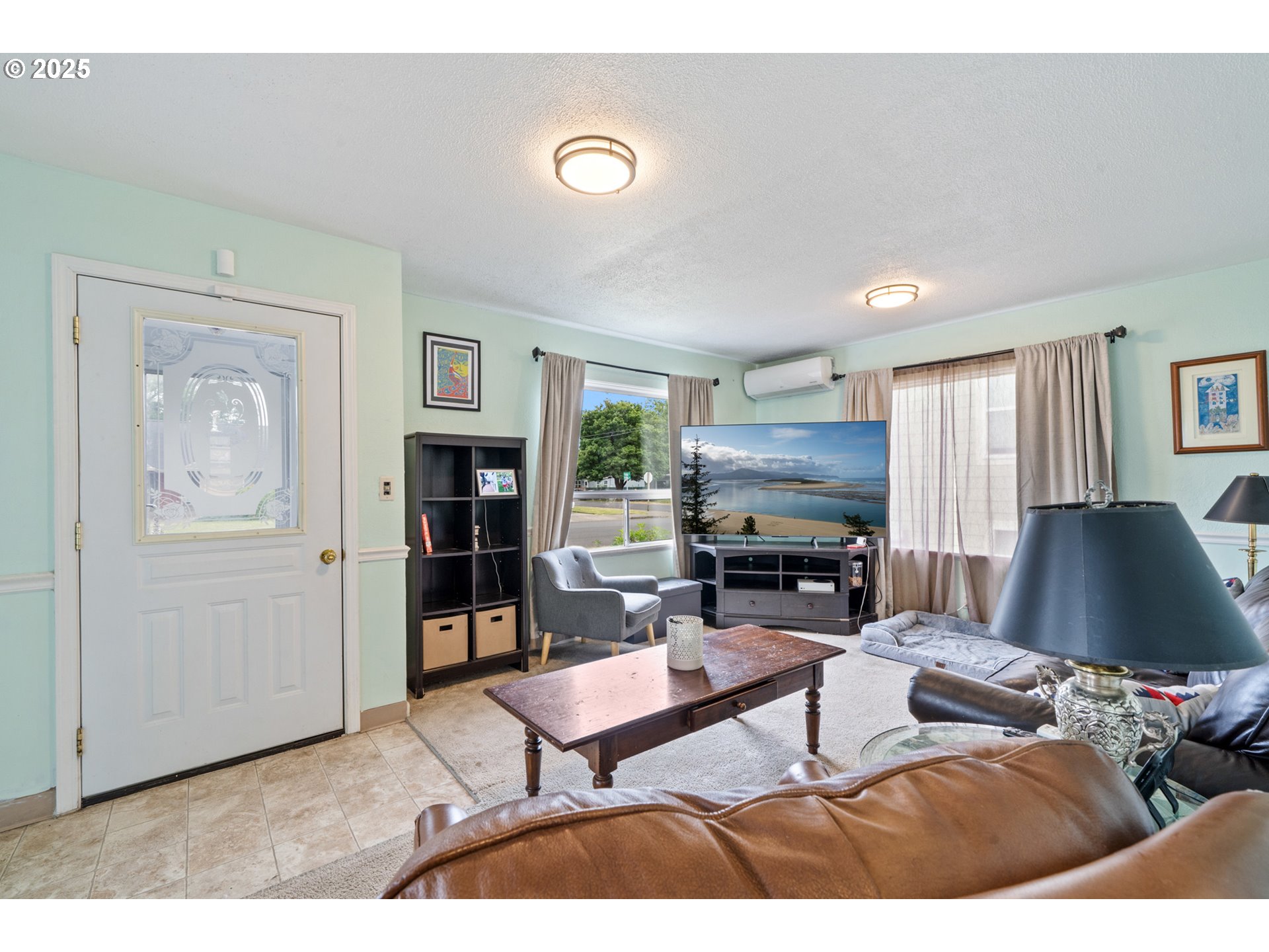 1706 5th Street Tillamook, OR 97141 - Photo 6 of 29 a living room with furniture and a fireplace