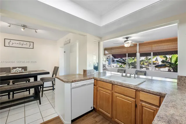 a room with sink cabinets and window