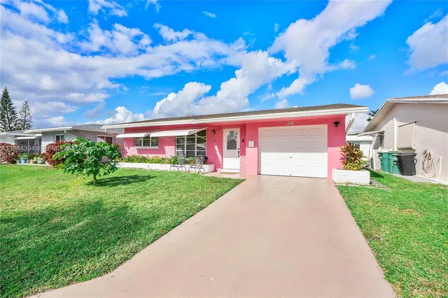 a view of a backyard with potted plants