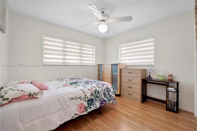 a bedroom with a bed and a table