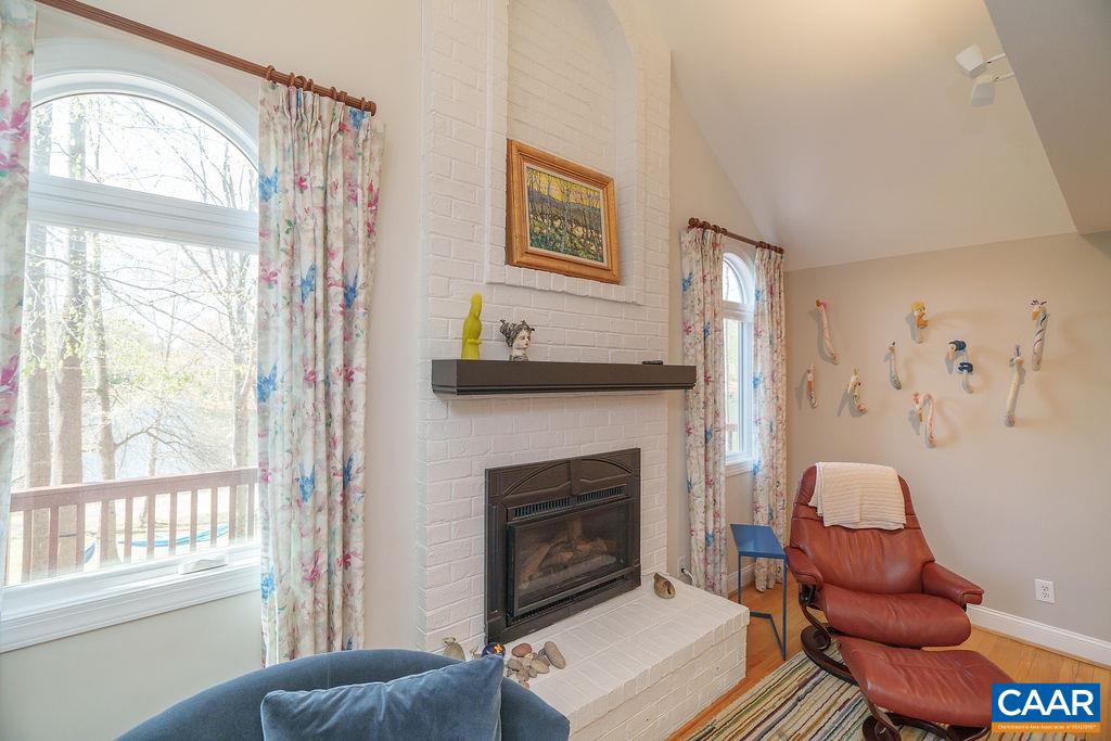 2976 Cove Trace Charlottesville, VA 22911 - Photo 12 of 62 a living room with furniture a window and a fireplace