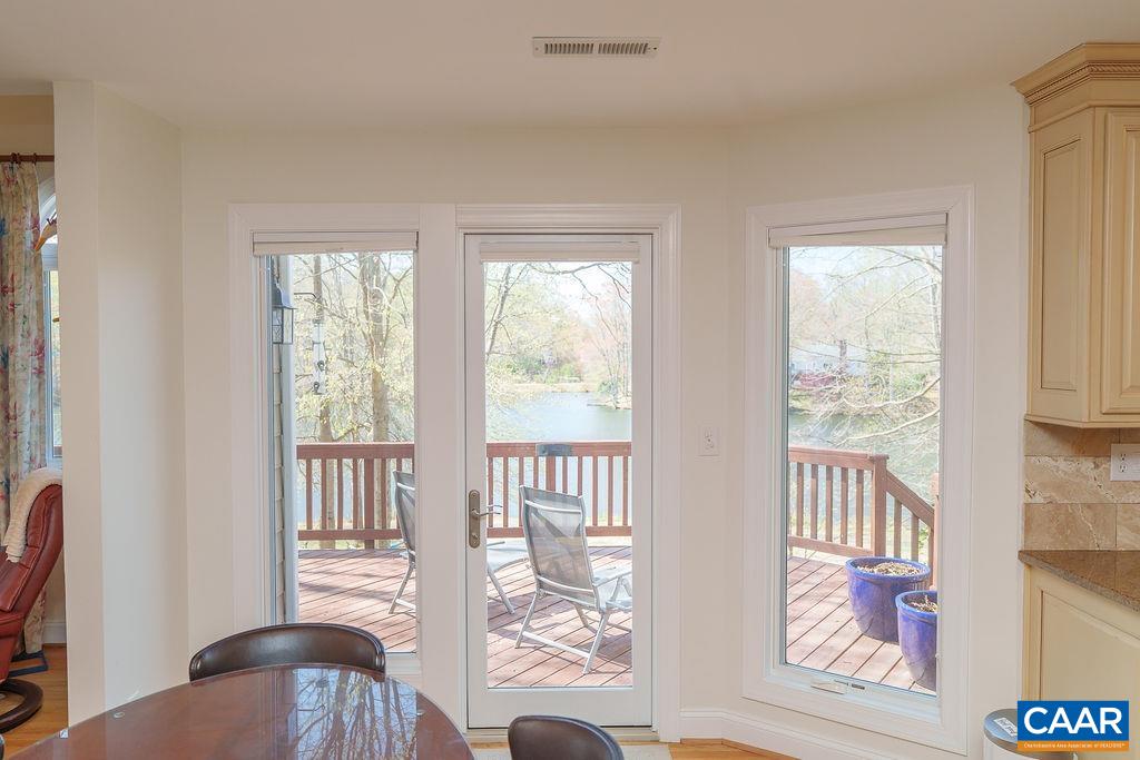 2976 Cove Trace Charlottesville, VA 22911 - Photo 16 of 62 a view of a bedroom with wooden floor