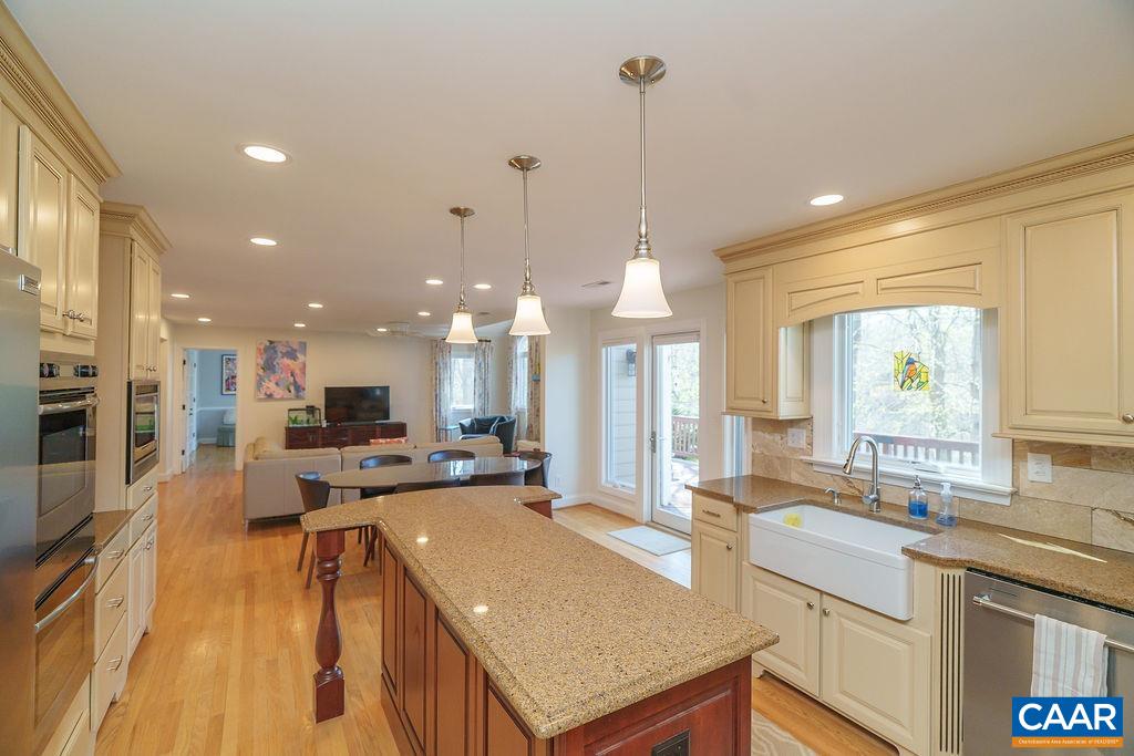 2976 Cove Trace Charlottesville, VA 22911 - Photo 21 of 62 a open kitchen with stainless steel appliances granite countertop a sink stove and refrigerator
