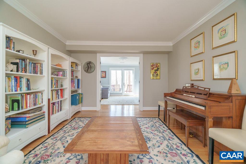 2976 Cove Trace Charlottesville, VA 22911 - Photo 3 of 62 a living room with furniture and a book shelf