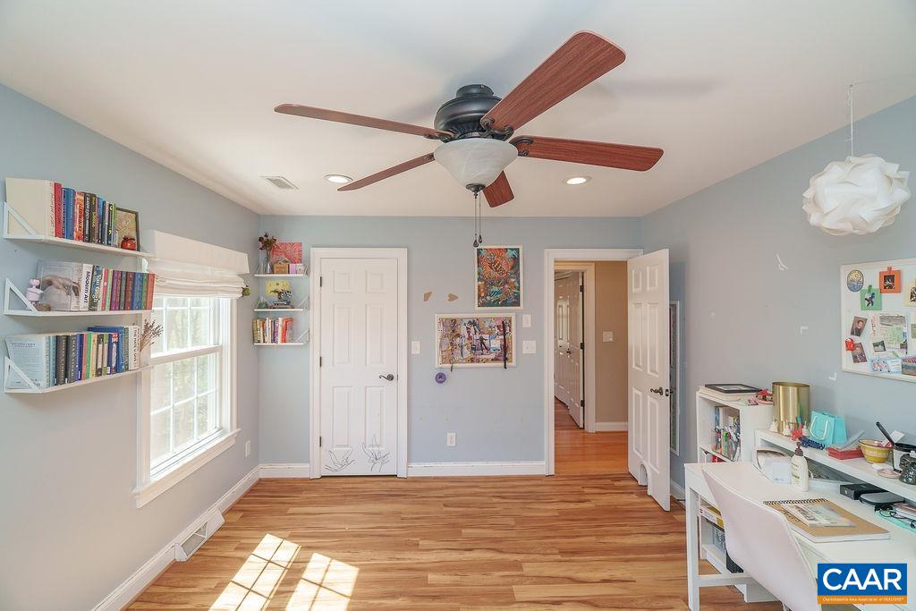2976 Cove Trace Charlottesville, VA 22911 - Photo 38 of 62 a view of an empty room with kitchen and a window