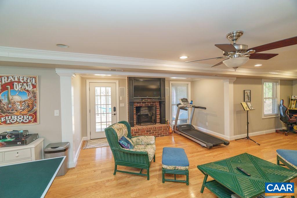 2976 Cove Trace Charlottesville, VA 22911 - Photo 44 of 62 a living room with furniture pool table and a fireplace
