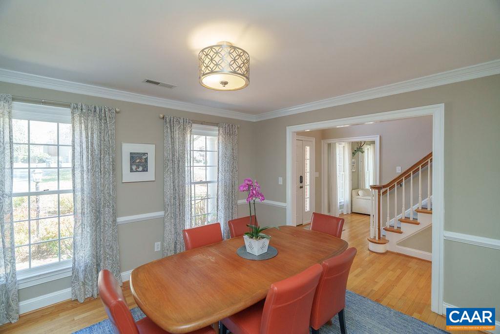 2976 Cove Trace Charlottesville, VA 22911 - Photo 8 of 62 a view of a dining room with furniture and wooden floor