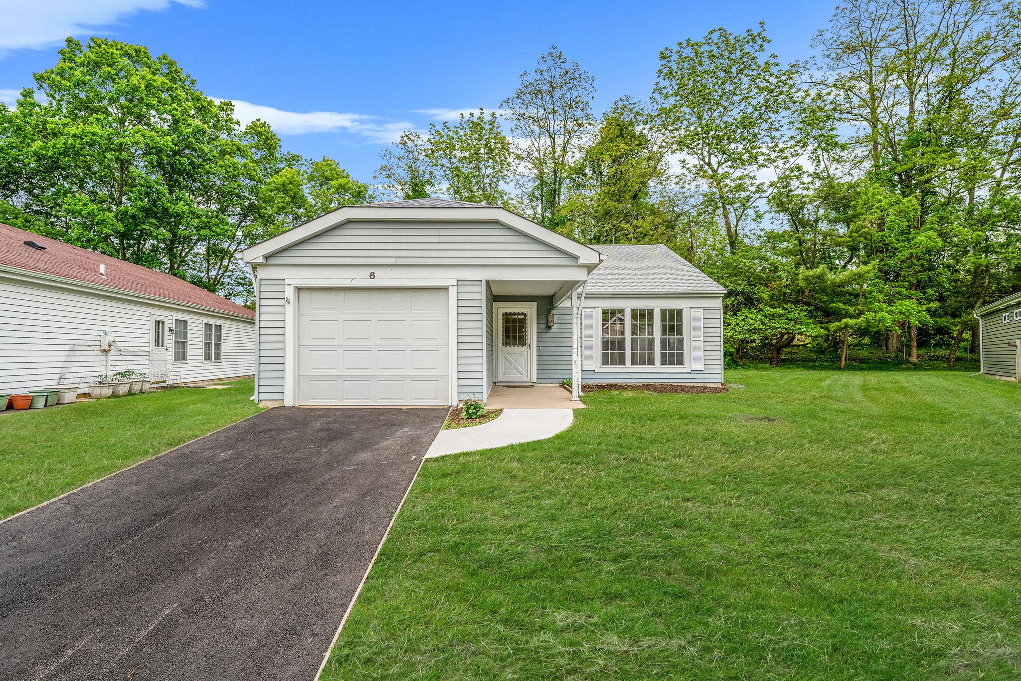 6 Lamont Court Ridge, NY 11961 - Photo 1 of 1 View of front of property with driveway, a garage, a front lawn, and a shingled roof