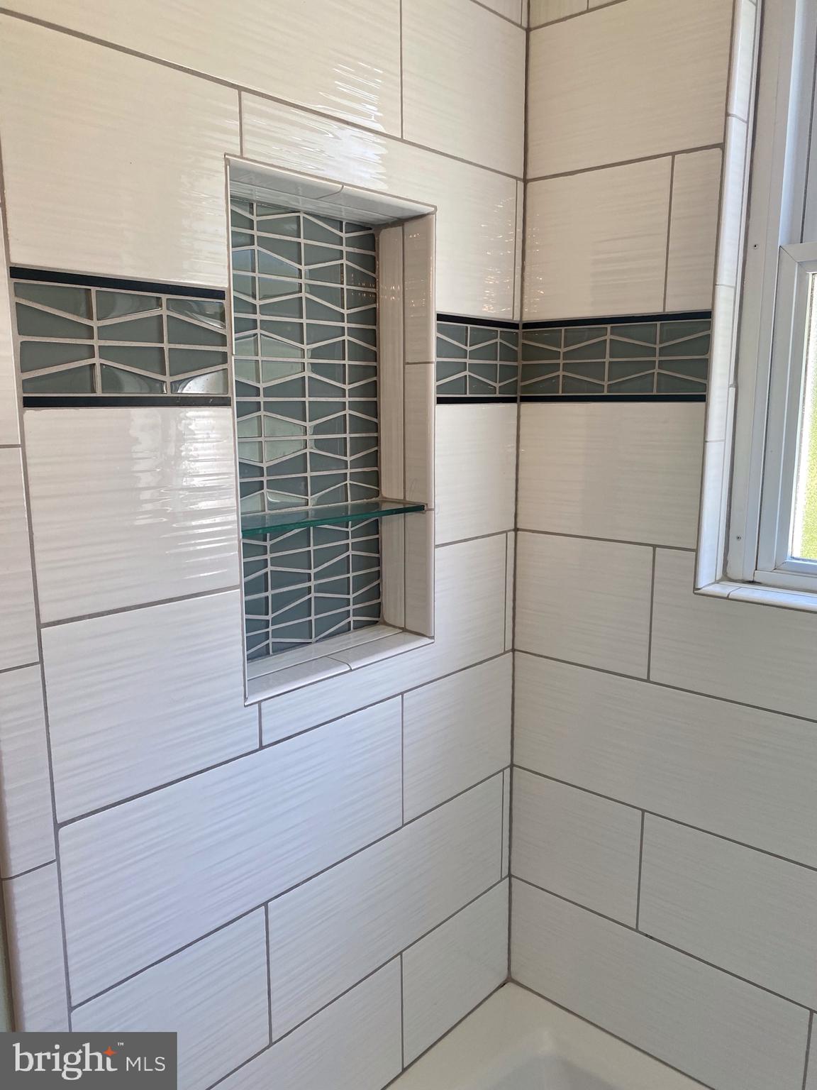 9901 Markham Street Silver Spring, MD 20901 - Photo 26 of 43 Custom tile work in bathroom