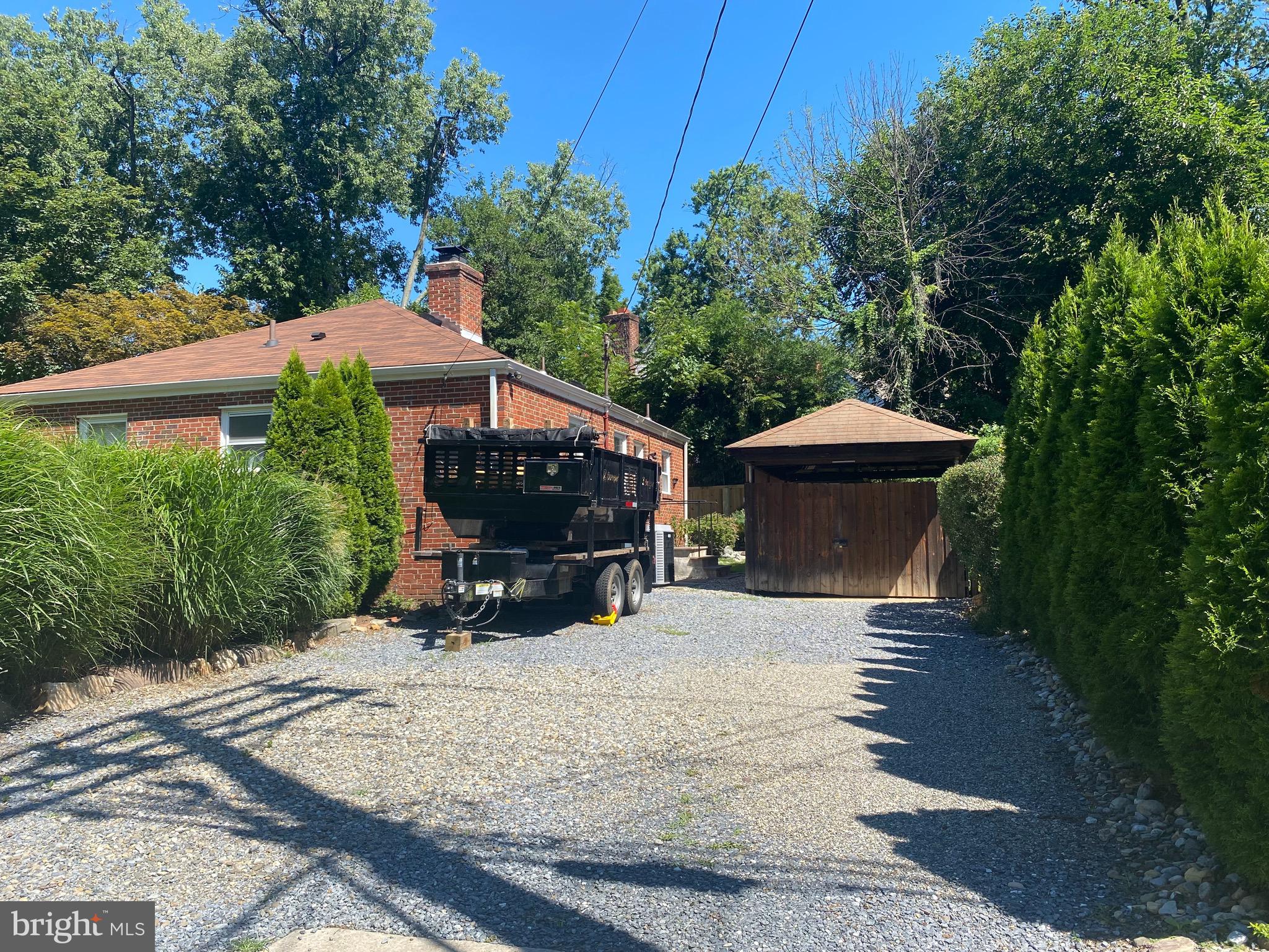 9901 Markham Street Silver Spring, MD 20901 - Photo 39 of 43 Long, wide driveway and carport