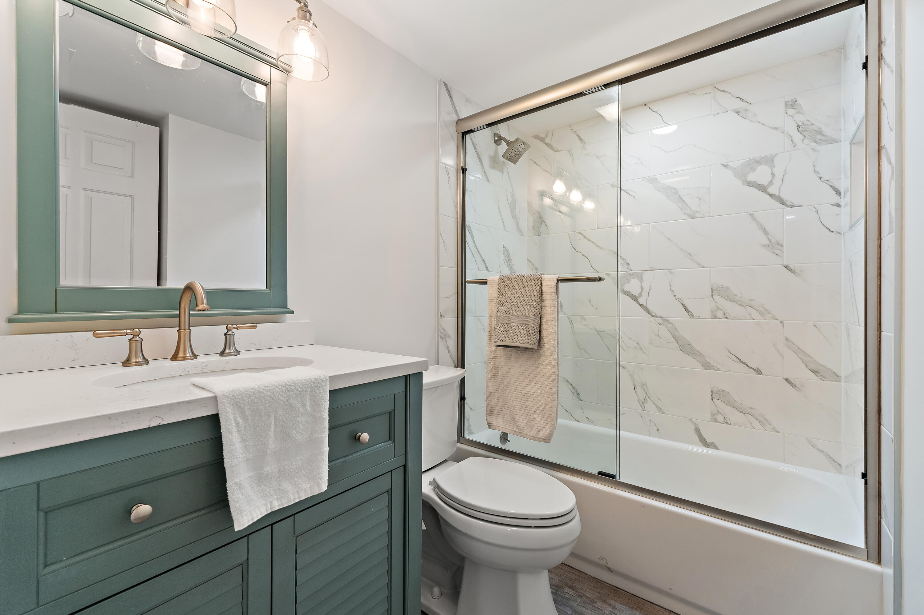 275 Palm Avenue, Unit A301 Jupiter, FL 33477 - Photo 13 of 38 a bathroom with a sink and a mirror