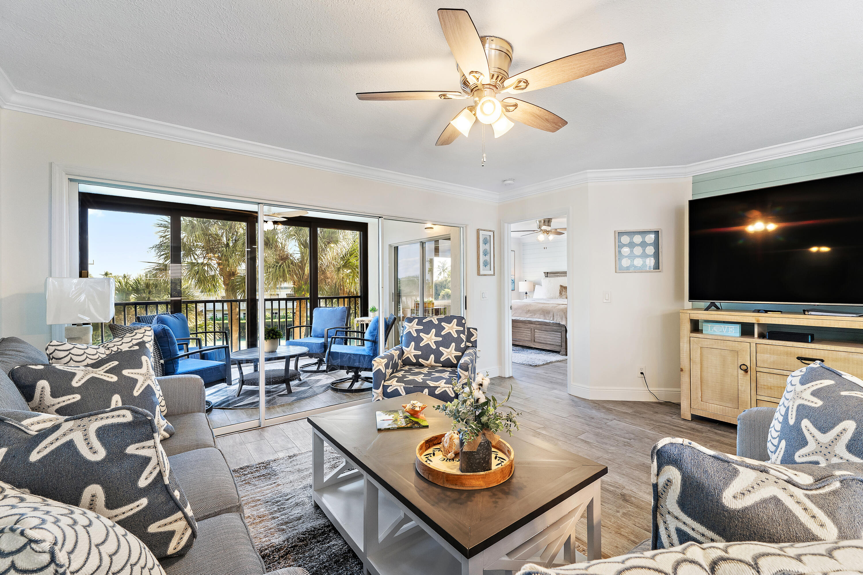 275 Palm Avenue, Unit A301 Jupiter, FL 33477 - Photo 17 of 38 a living room with furniture kitchen view and a large window