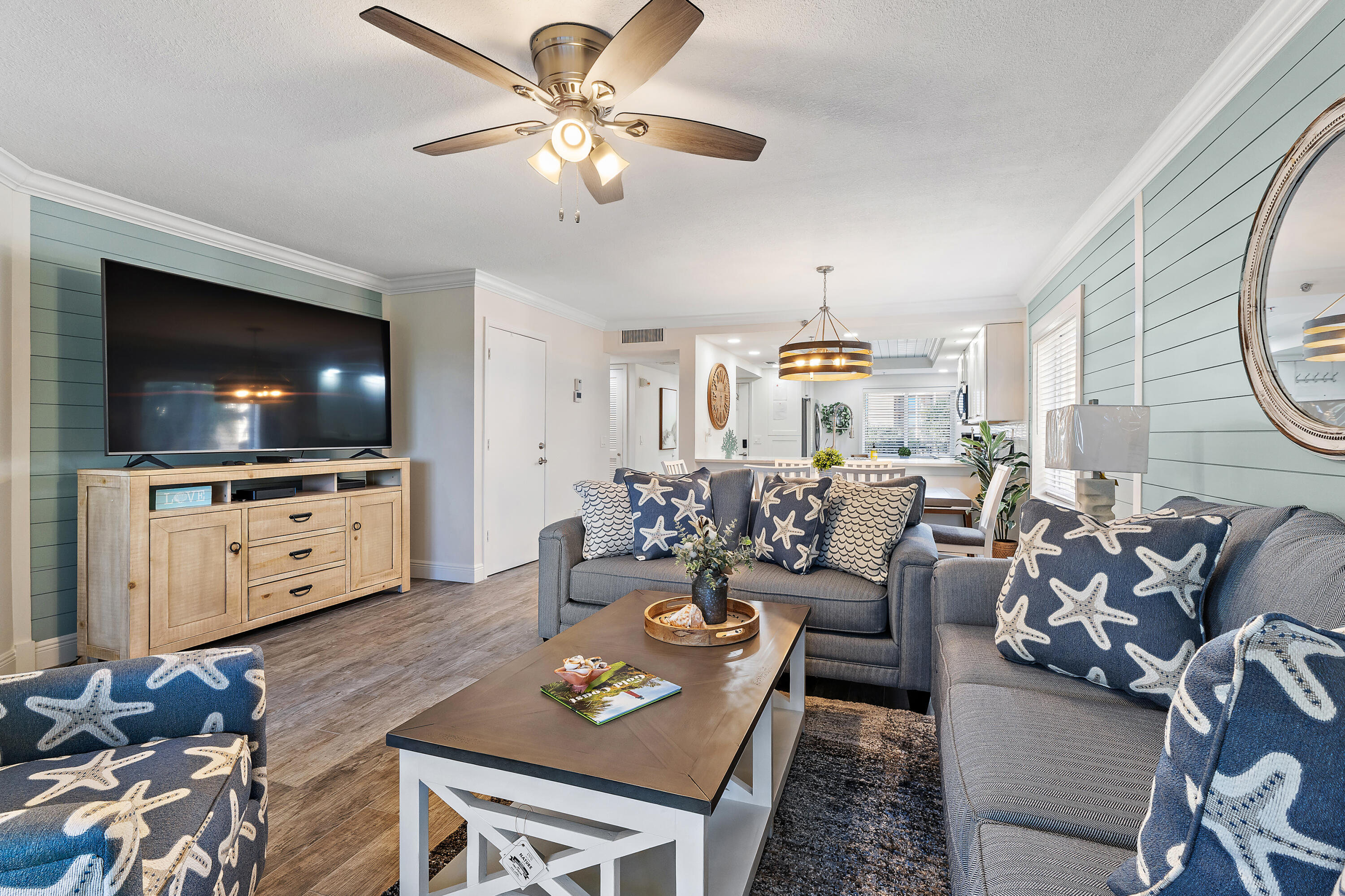 275 Palm Avenue, Unit A301 Jupiter, FL 33477 - Photo 19 of 38 a living room with furniture and a flat screen tv