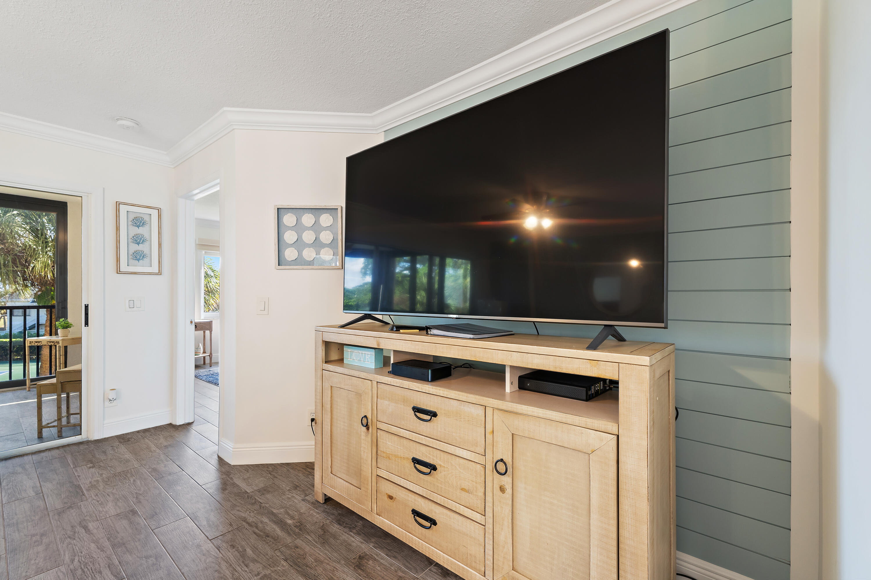 275 Palm Avenue, Unit A301 Jupiter, FL 33477 - Photo 20 of 38 a kitchen with stainless steel appliances a stove and a wooden floor