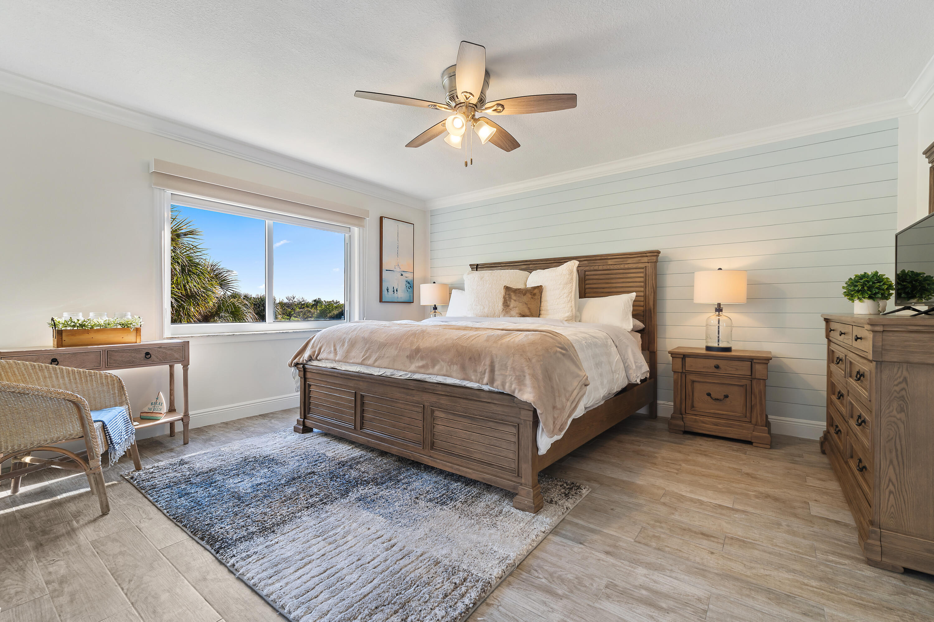 275 Palm Avenue, Unit A301 Jupiter, FL 33477 - Photo 21 of 38 a bedroom with a large bed and a chandelier