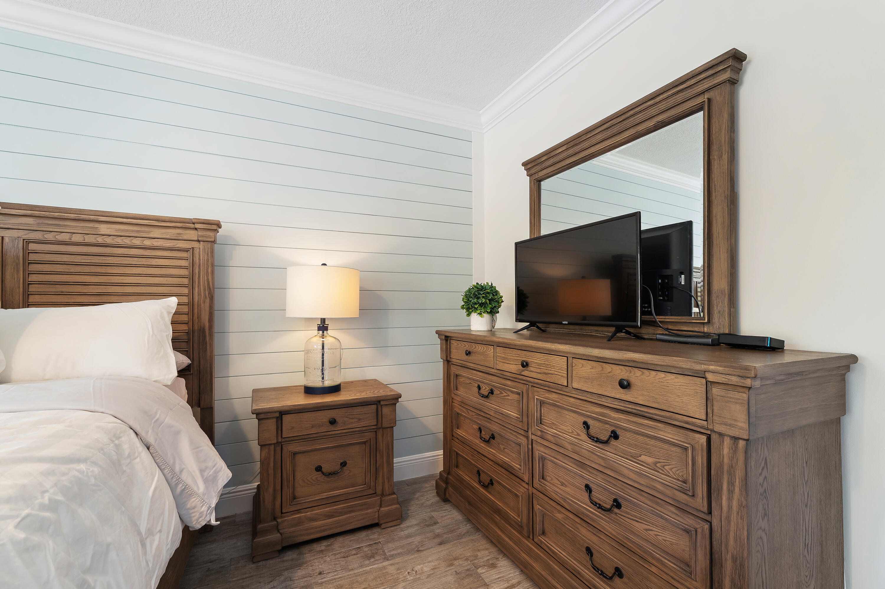 275 Palm Avenue, Unit A301 Jupiter, FL 33477 - Photo 22 of 38 a bedroom with a bed and a flat screen tv